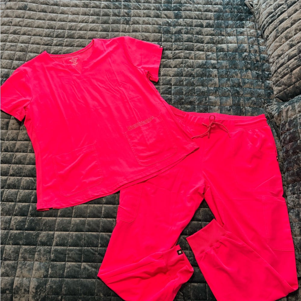 Hot pink Beyond Scrubs set-front pocket top and joggers